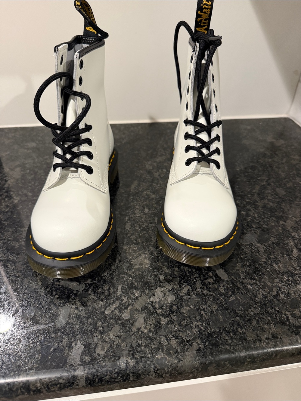 Dr. Martens White Leather Lace-Up Boots with Black Laces and Yellow Stitching